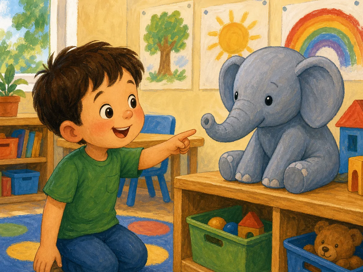 Niño señalando un elefante con trompa en el aula
